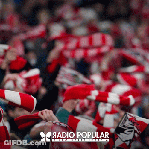 A Blurred Image Of A Crowd Of People With A Radio Popular Logo In The Corner GIF