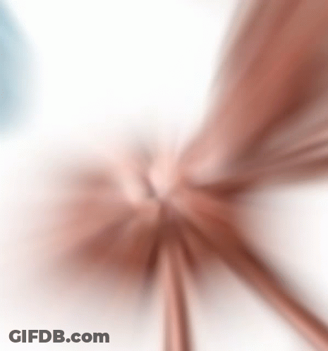 A Blurred Image Of A Flower On A White Background . GIF