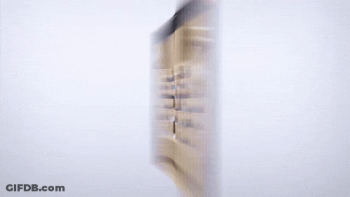 A Blurred Image Of A Group Of People In A Lecture Hall Is Displayed On A Computer Monitor GIF
