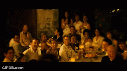 A Blurred Image Of A Group Of People Sitting At Tables GIF