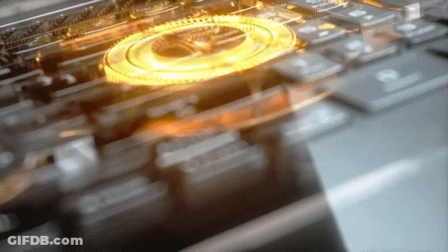 A Blurred Image Of A Keyboard With A Gold Circle In The Center GIF