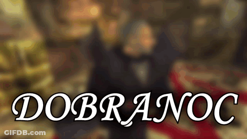 A Blurred Image Of A Man And Woman With The Words " Dobranoc " In The Foreground GIF