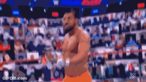 A Blurred Image Of A Man In A Boxing Ring With A W Logo In The Corner GIF