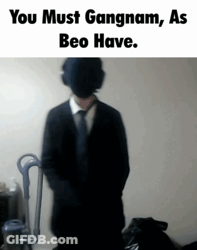 A Blurred Image Of A Man In A Suit And Tie With The Words You Must Gangnam As Beo Have GIF