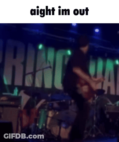 A Blurred Image Of A Man Playing A Guitar On Stage With The Words Aight Im Out Above Him GIF