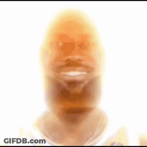 A Blurred Image Of A Man 'S Face With A White Background GIF
