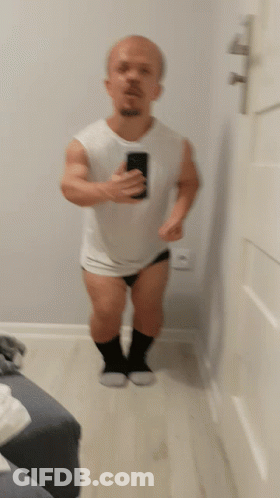 A Blurred Image Of A Man Taking A Picture Of Himself GIF