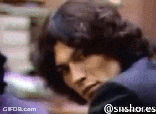 A Blurred Image Of A Man With The Hashtag @Snshores GIF