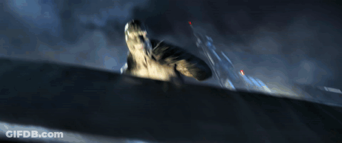 A Blurred Image Of A Monster With A Red Light In The Corner GIF