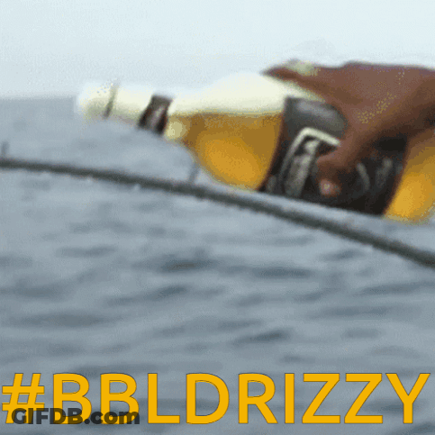 A Blurred Image Of A Person Holding A Beer Bottle With The Words #Bbldrizzy In Yellow Letters GIF