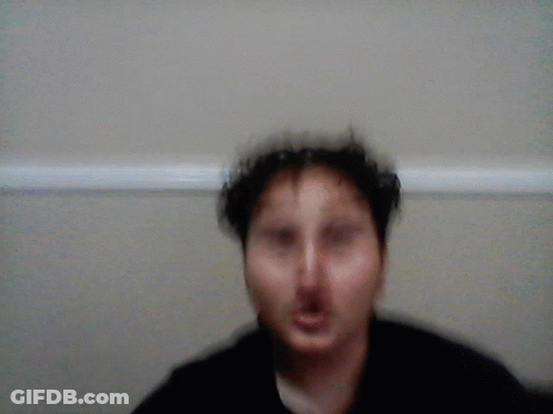 A Blurred Image Of A Person In A Closet With A White Railing GIF