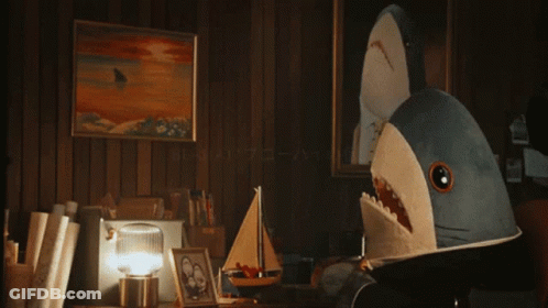 A Blurred Image Of A Person Looking At A Picture On A Table GIF
