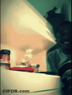 A Blurred Image Of A Person Opening A Fridge GIF