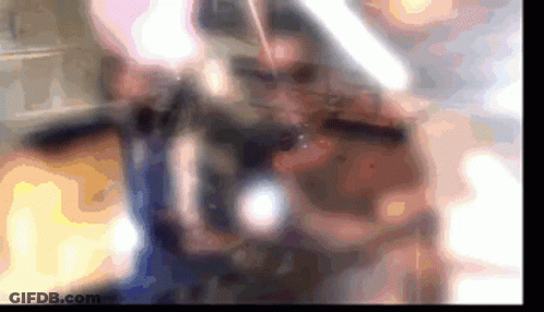 A Blurred Image Of A Person Playing A Violin GIF