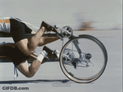 A Blurred Image Of A Person Riding A Bicycle With The Words " Low Time Machine " On The Bottom GIF