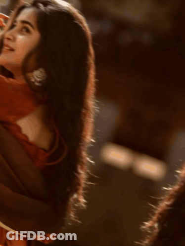 A Blurred Image Of A Person 'S Face Against A Grey Background GIF