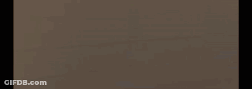 A Blurred Image Of A Person 'S Face With A Brain Logo In The Background . GIF