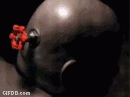 A Blurred Image Of A Person 'S Face With A Flower In The Background GIF