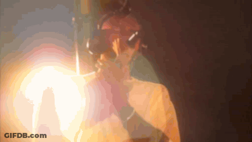 A Blurred Image Of A Person 'S Face With A Light Behind Them GIF
