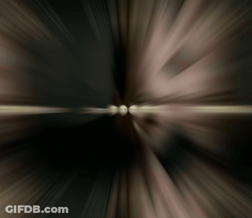 A Blurred Image Of A Person 'S Face With A Light Coming Out Of The Middle GIF