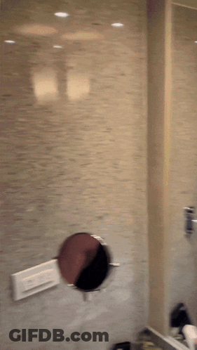 A Blurred Image Of A Person 'S Face With A Reflection Of A Person In The Mirror GIF