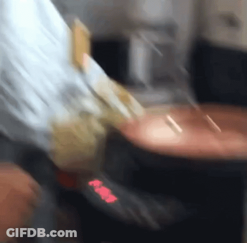 A Blurred Image Of A Person 'S Hand Holding A Piece Of Paper That Says ' Aa ' GIF