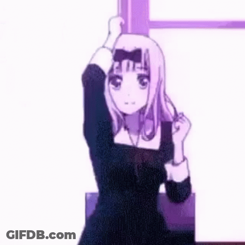 A Blurred Image Of A Person 'S Hand Reaching Out Towards A Pink Wall GIF