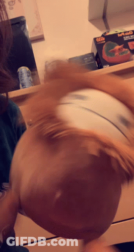 A Blurred Image Of A Person 'S Head With A Box In The Background That Says ' Xbox ' On It GIF