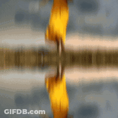 A Blurred Image Of A Person 'S Reflection In The Water GIF