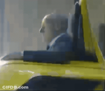A Blurred Image Of A Person Sitting In A Yellow Chair GIF