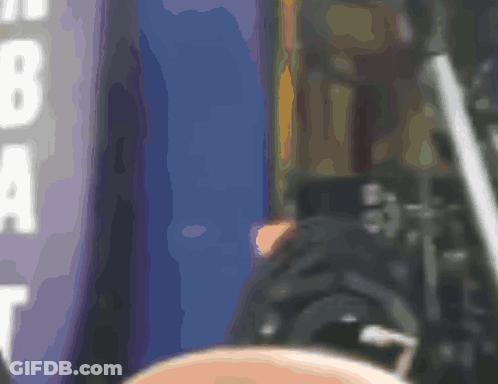 A Blurred Image Of A Person Standing In Front Of A Sign That Says Nba GIF