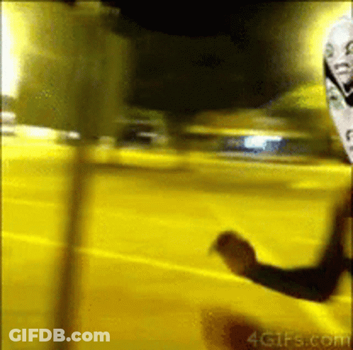 A Blurred Image Of A Person Standing In Front Of A Yellow Wall That Says 4Gifs.com On It GIF