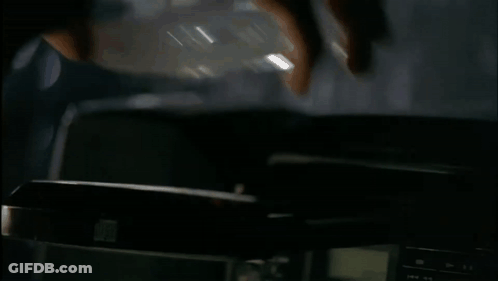 A Blurred Image Of A Person Standing On A Desk GIF
