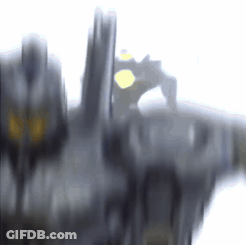 A Blurred Image Of A Person Standing On A Ledge GIF
