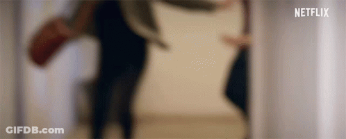 A Blurred Image Of A Person Walking Down Stairs . GIF