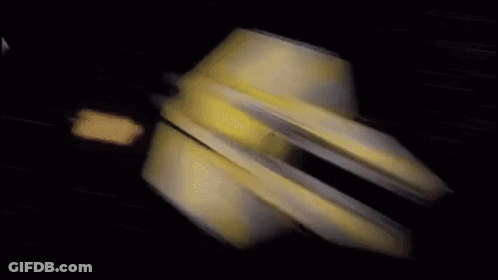 A Blurred Image Of A Plane Flying Through A Dark Blue Sky GIF