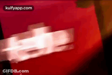 A Blurred Image Of A Red Background With The Words Kulfyapp.com On The Bottom GIF