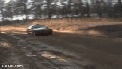 A Blurred Image Of A Red Car With A License Plate That Says ' Nc ' On It GIF