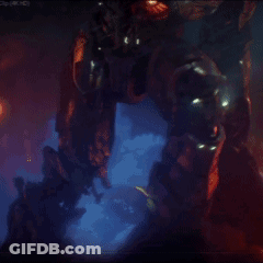 A Blurred Image Of A Robot In A Dark Room With Lights Shining On It GIF
