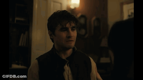 A Blurred Image Of A Room With A Lamp And Curtains GIF