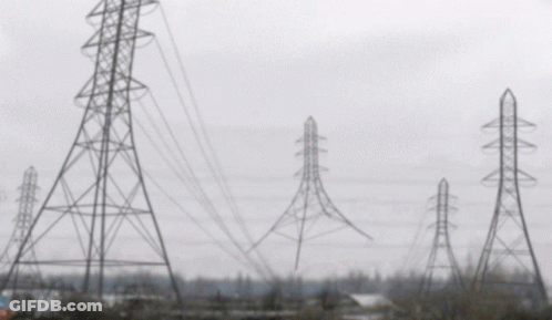 A Blurred Image Of A Row Of Power Lines And Towers GIF