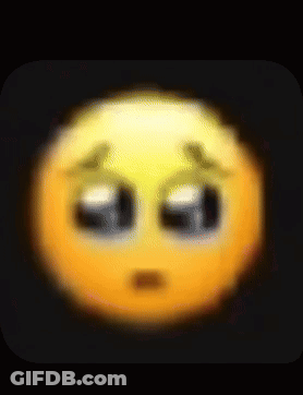 A Blurred Image Of A Sad Smiley Face With Tears Coming Out Of Its Eyes . GIF