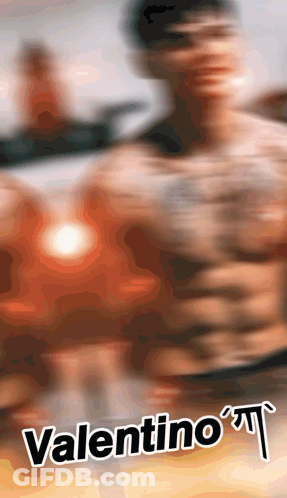 A Blurred Image Of A Shirtless Man With The Name Valentino GIF