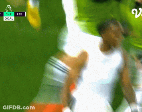 A Blurred Image Of A Soccer Game With The Score 1-2 Lee GIF