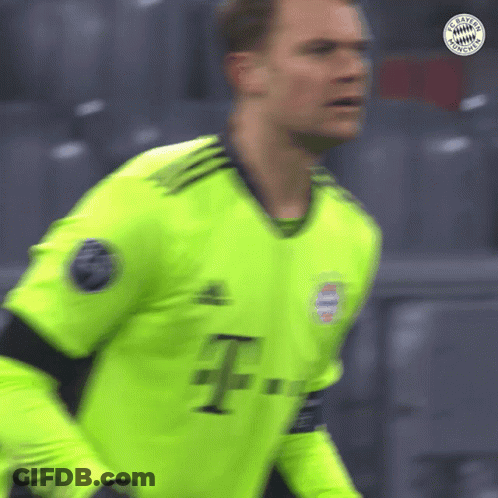 A Blurred Image Of A Soccer Player Wearing A Neon Green Jersey GIF