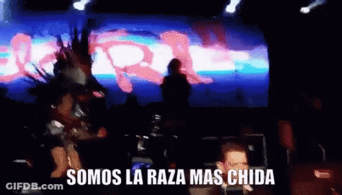 A Blurred Image Of A Stage With The Words Somos La Raza Mas Chida On The Bottom GIF