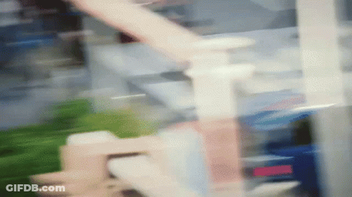 A Blurred Image Of A Staircase In A Building GIF