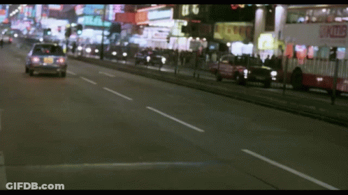 A Blurred Image Of A Street With A Sign That Says ' A ' On It GIF