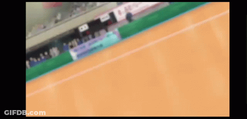 A Blurred Image Of A Tennis Court With A Sign That Says ' Allianz ' On It GIF