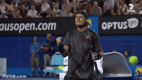 A Blurred Image Of A Tennis Court With An Ad For Medibank GIF